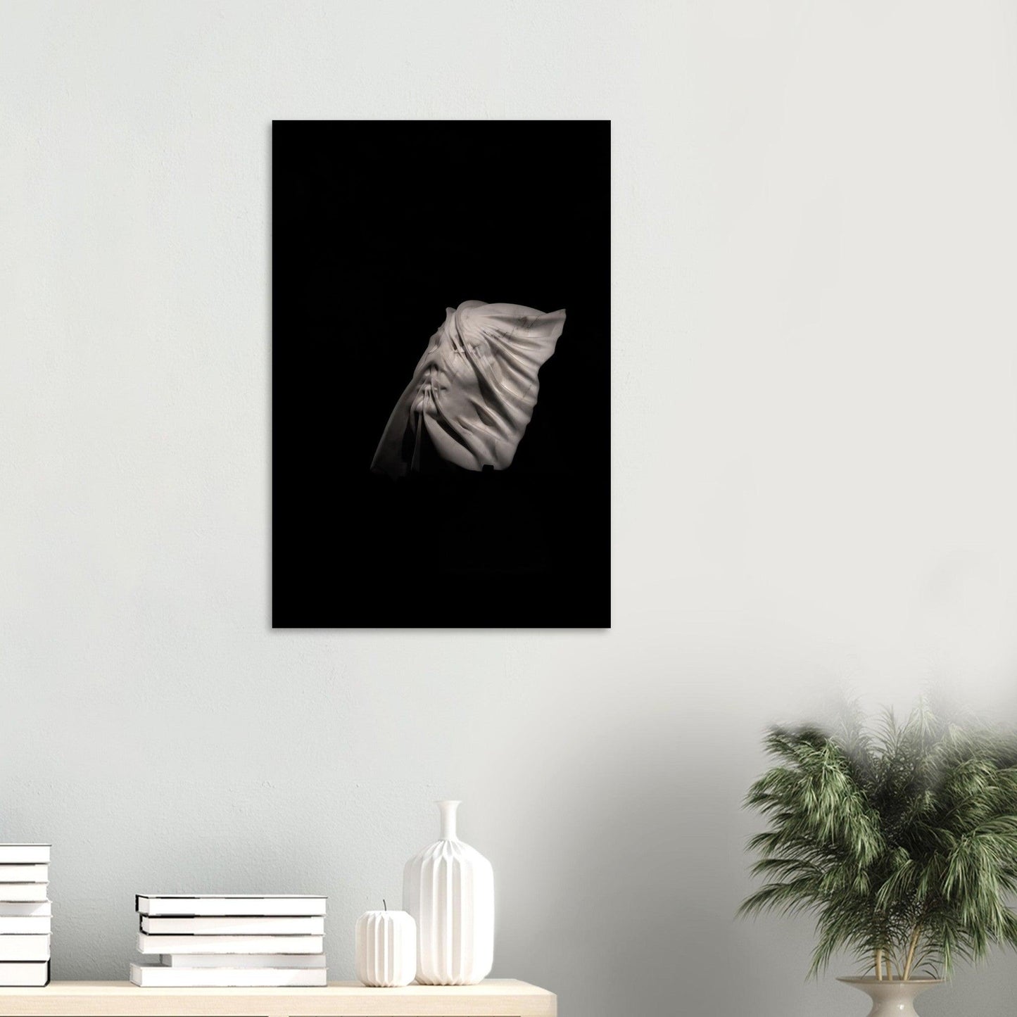 sculptured woman’s beautiful face on a black background metal wall art